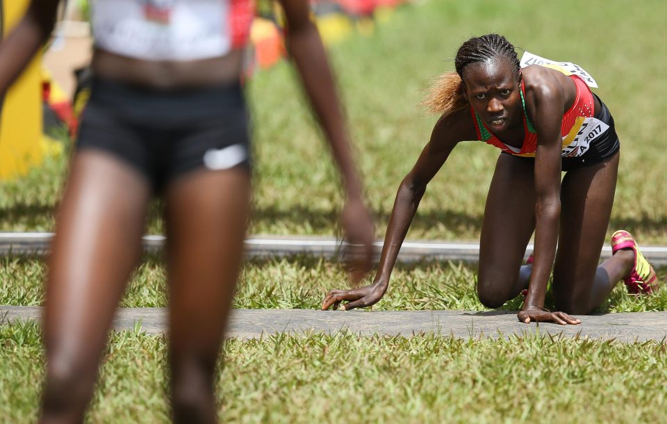  Hellen Ekalale Lobun of Kenya collapses after the U20 women race