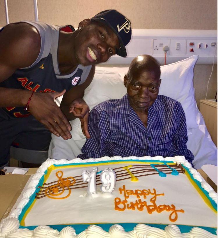  Paul Pogba stood over his father with a birthday cake