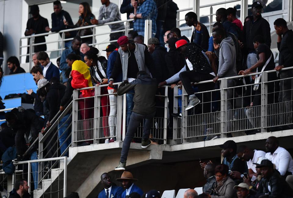  Fans climbed down the tiers of the Stade Sebastien Charlety