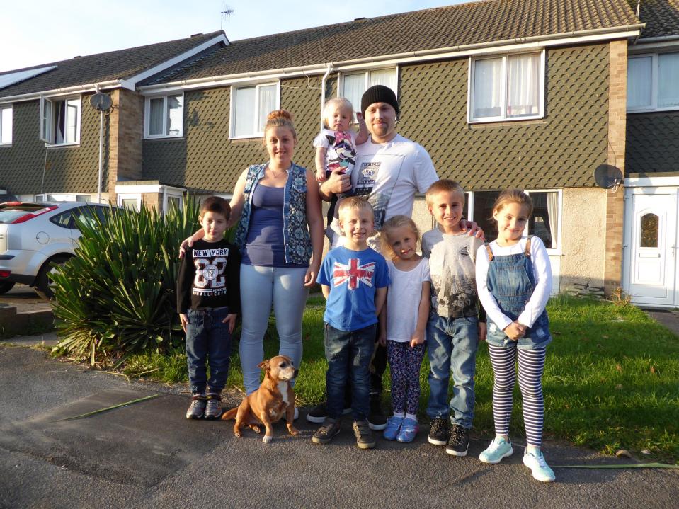  Anthony and Kayleigh with their six children outside their home