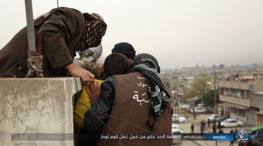  The sick jihadis released photos of the execution, including this moment when he was held on the rooftop