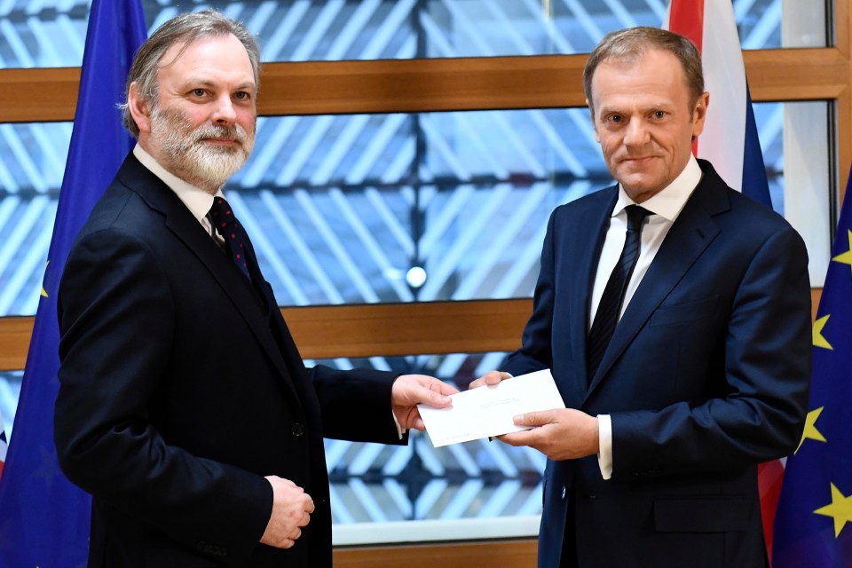 We're off . . . British ambassador to the EU Tim Barrow hands Article 50 letter to Donald Tusk