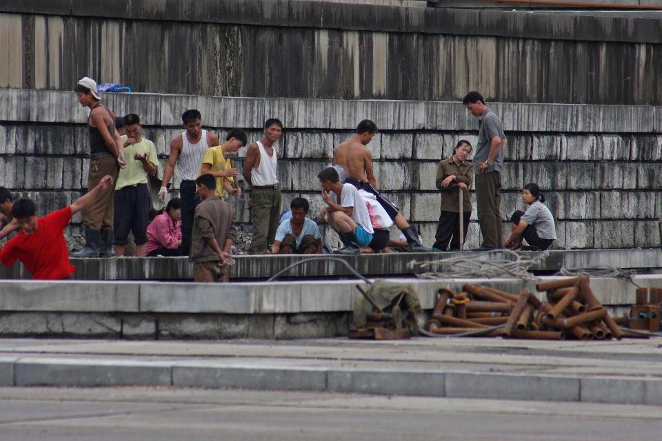  Workers pictured at a Pyongyang dock. Some North Korean workers are sent abroad to work on building projects in horror conditions