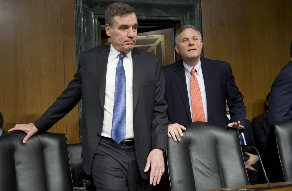  Mark Warner, left, and Richard Burr, right, arrive at a committee session probing alleged election interference by Russia