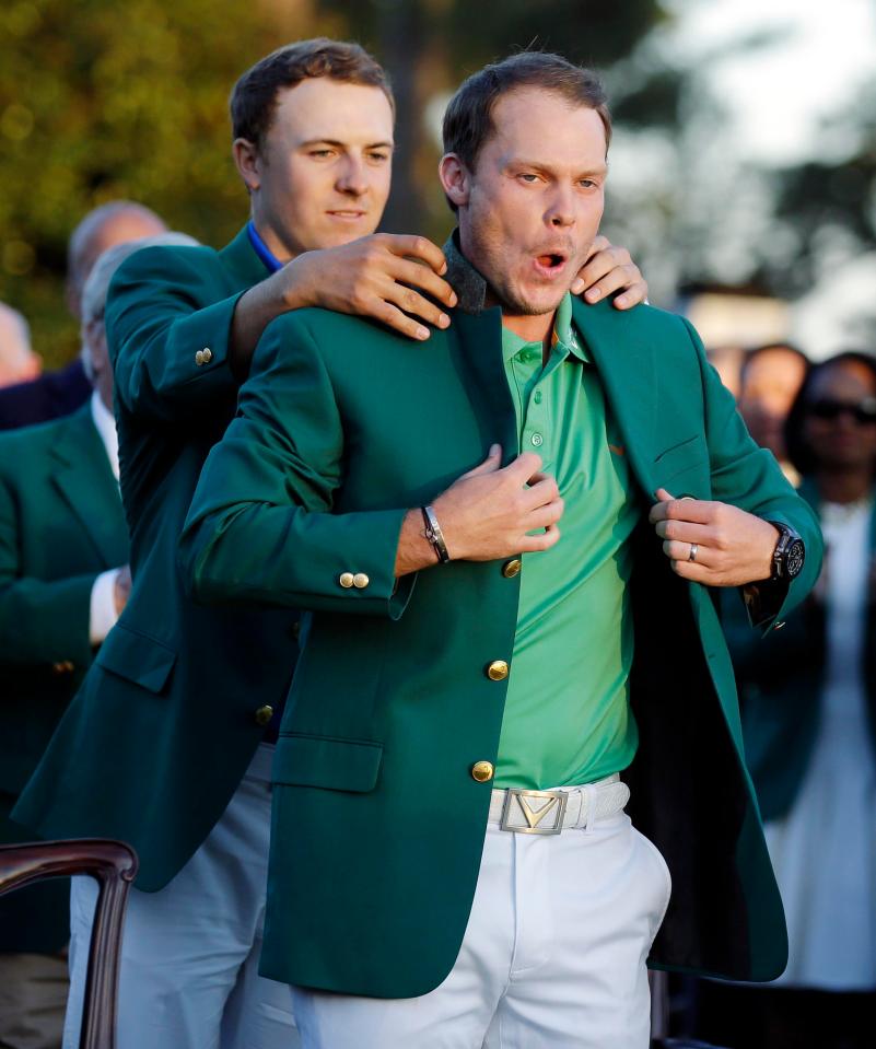  Danny Willett slips into his green jacket after winning the 2016 Masters