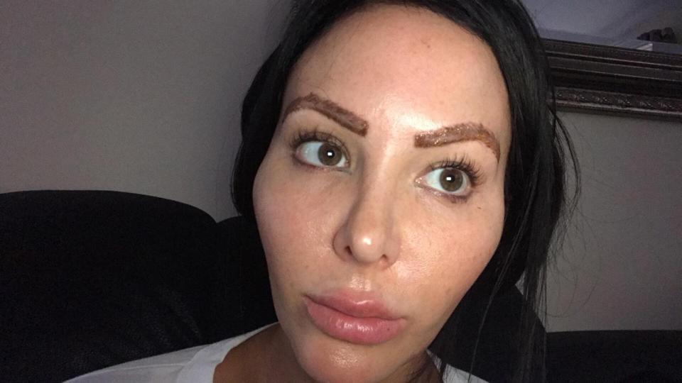  Her thick brows were inked on semi-permanently with the left in a wonky fashion