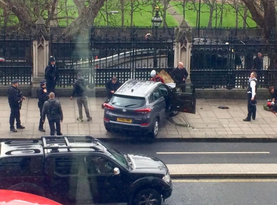  A car crashed into gates outside Parliament after mowing down up to a dozen people on Westminster Bridge causing carnage in the capital