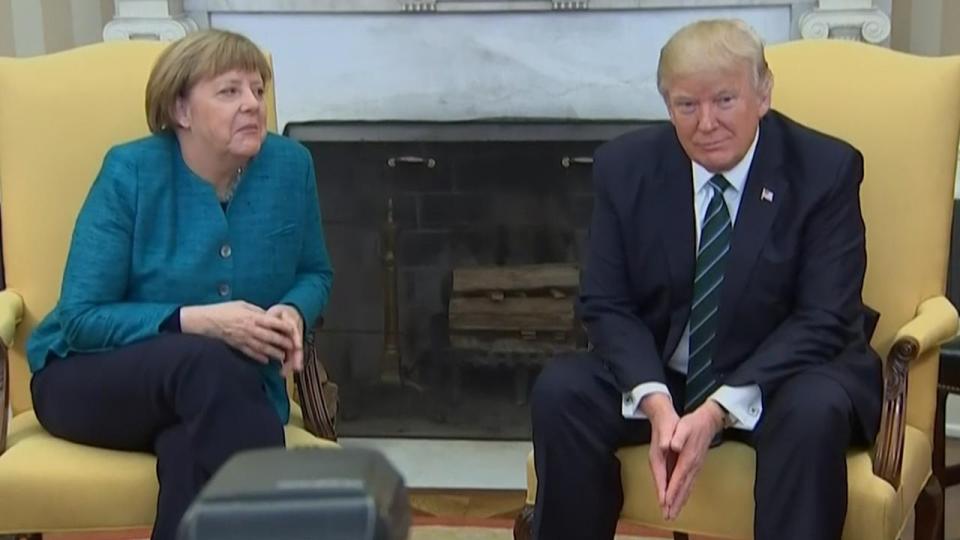  Trump appears to ignore requests to shake the German chancellor's hand