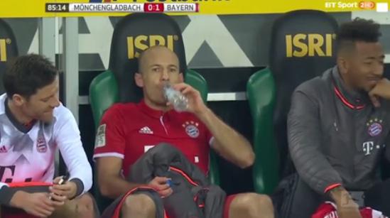  Arjen Robben didn't find the funny side as his team-mates were laughing next to him