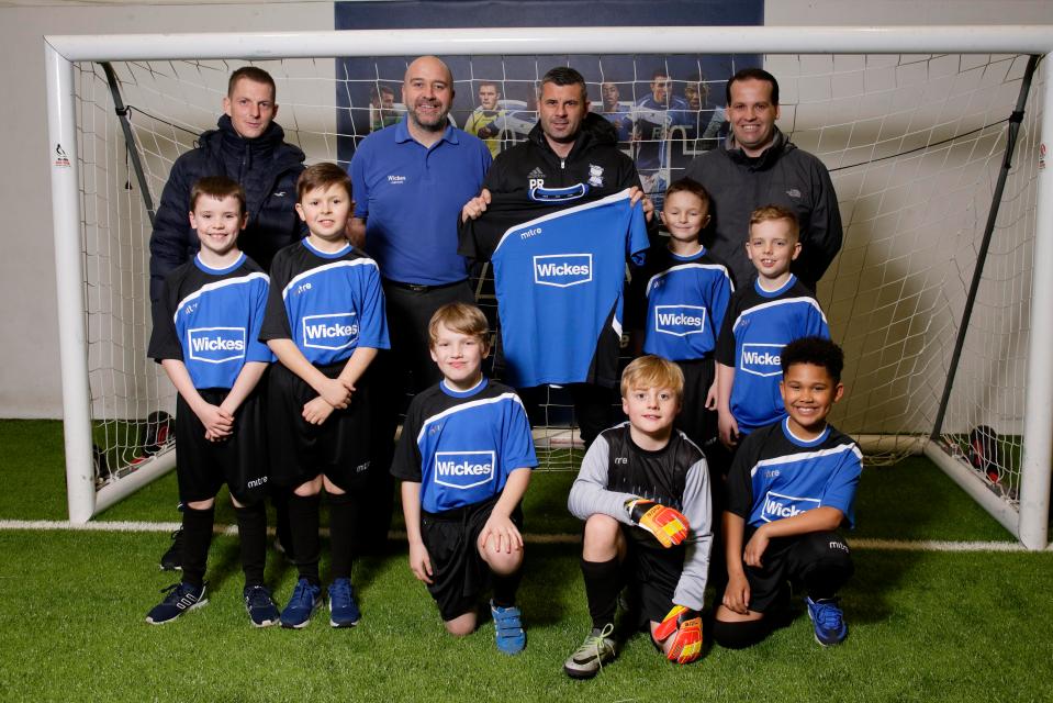  Robinson handed a local youth team new kit after they won a competition