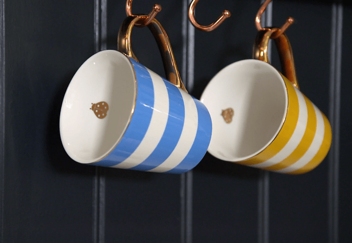  The mugs come in sets of two; blue and yellow or green and black