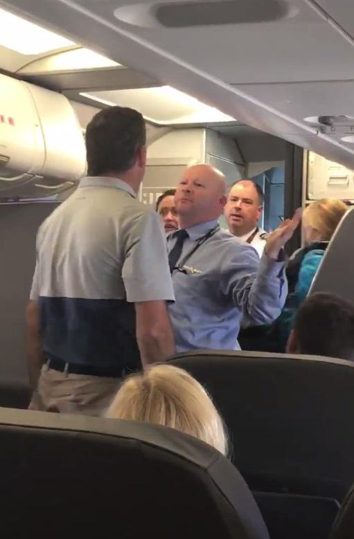  When a stranger came to her defence he became embroiled in a fight with an American Airlines employee