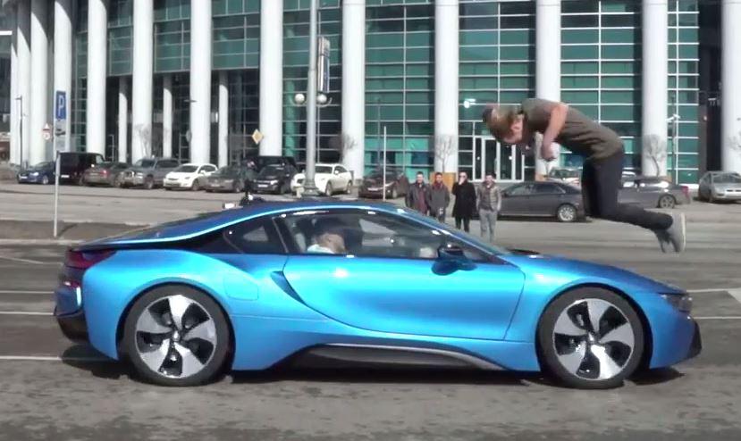  Oleg Sherstyachenko appears to fling himself over the top of the BMW- performing a barrel roll in mid air