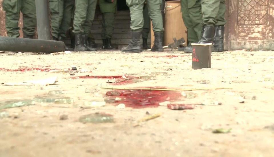  Syrian state media shows footage of blood splatters on the floor of the army base