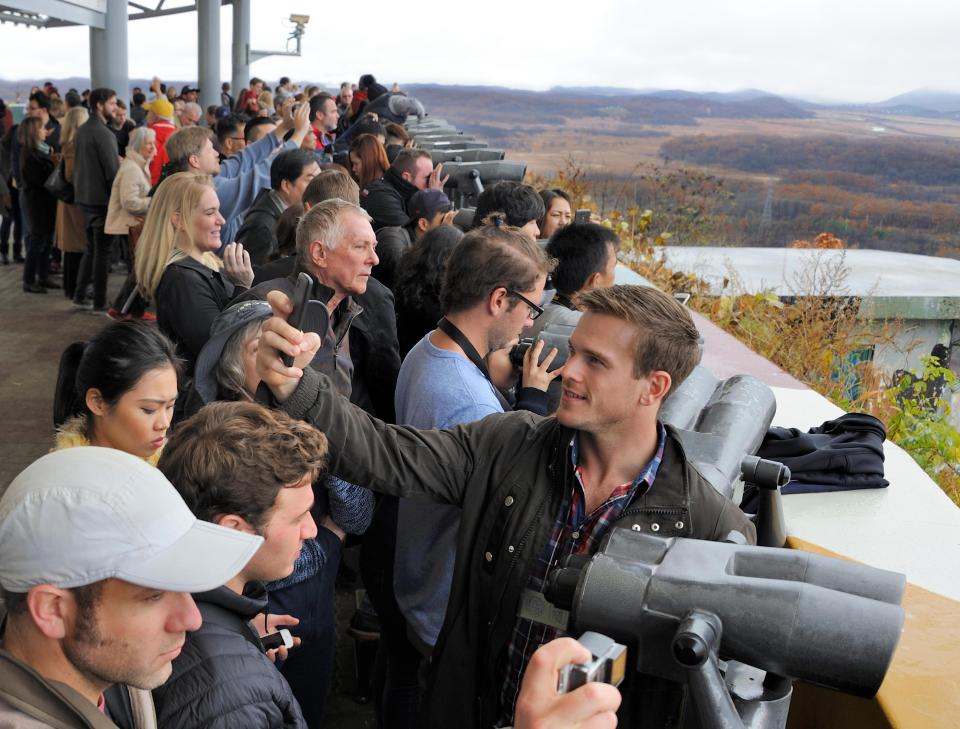  Tourists at the DMZ between North and South Korea