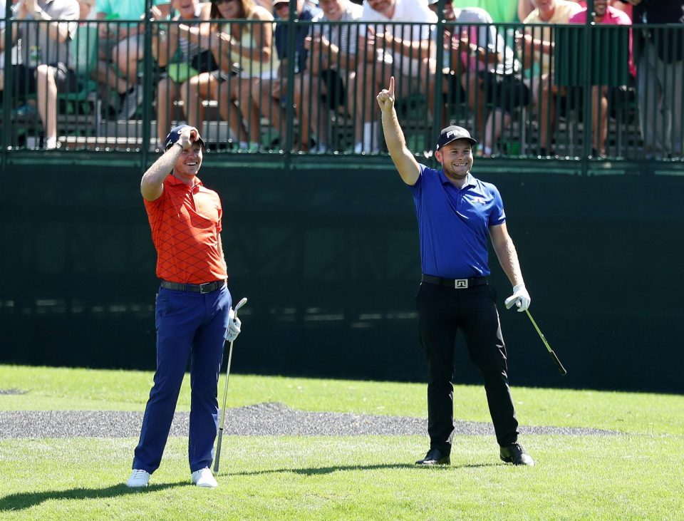  The English duo celebrate after hitting their shots onto the green