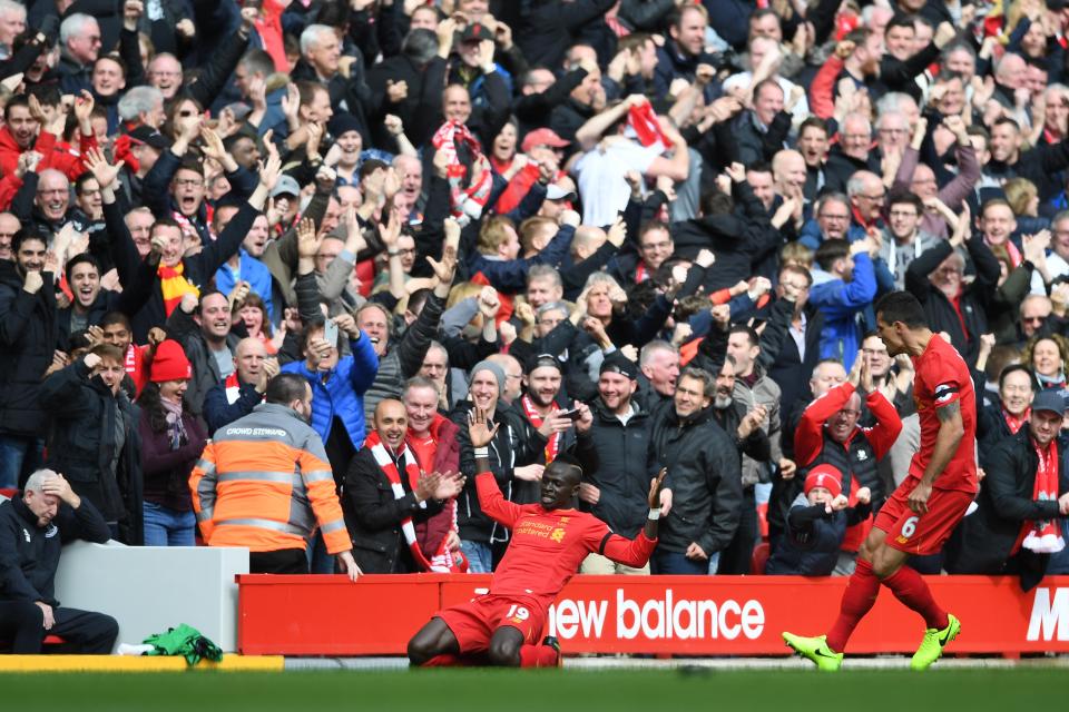  Mane celebrates his opener in front of the Liverpool bench