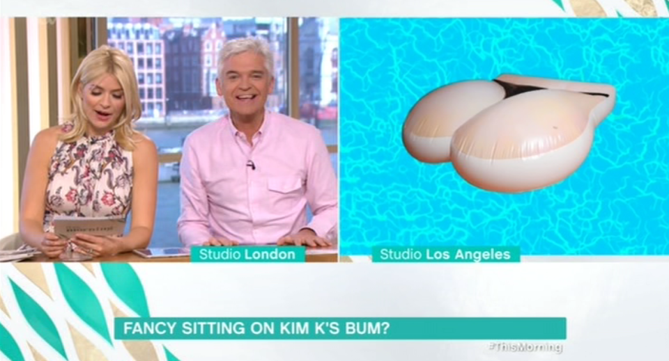  Holly was shocked that the float is in the exact proportions of Kim's bum