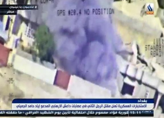  Smoke rises from the building after a direct hit from Iraqi forces