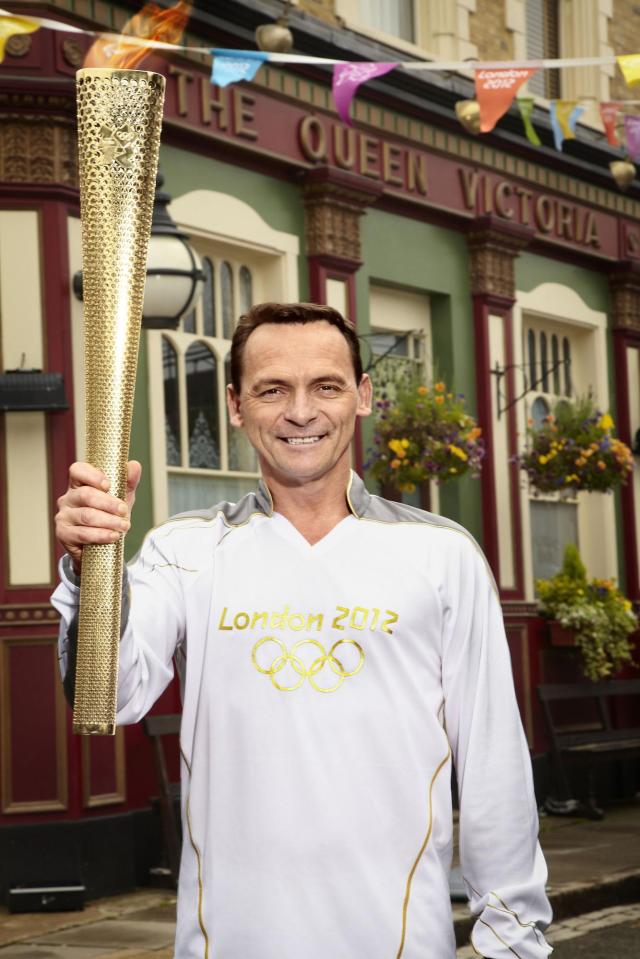  Perry carried the Olympic torch through Walford in 2012