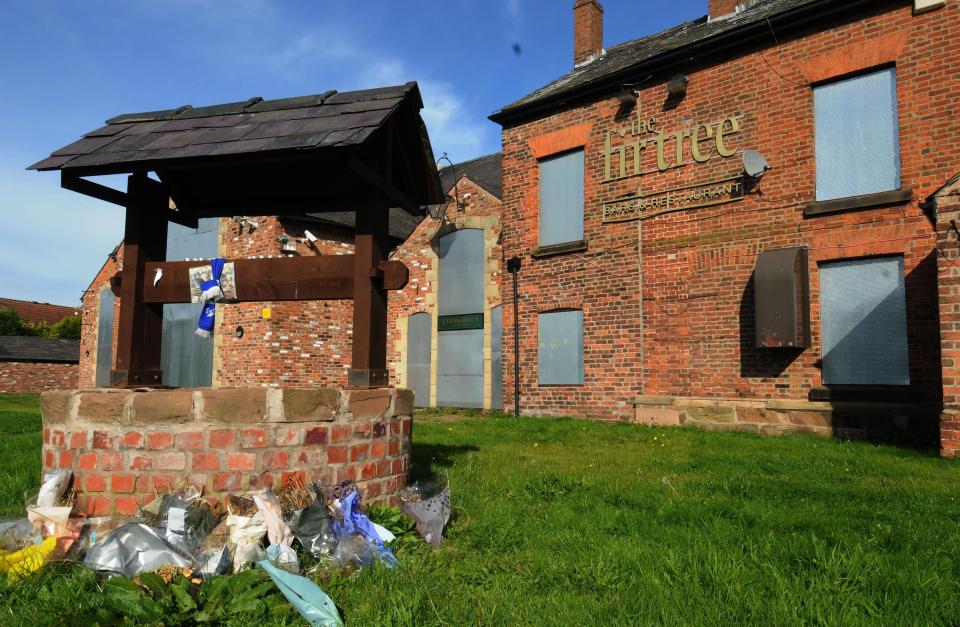  Flowers are laid outside The Fir Tree pub, where Rhys was slain in the car park