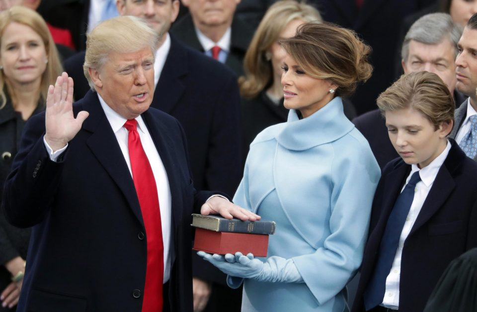  Donald Trump swears in as the 45th President of the United States of America. Looking on are First Lady Melania Trump and 10-year-old son Barron Trump