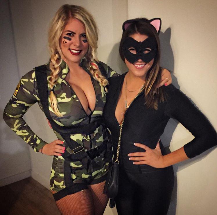  Busty Kelley Cahill (left) flaunts her figure in fancy dress