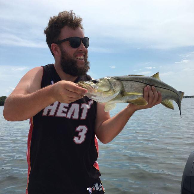  'Beef' proudly shows off his catch after his early exit at the Houston Open