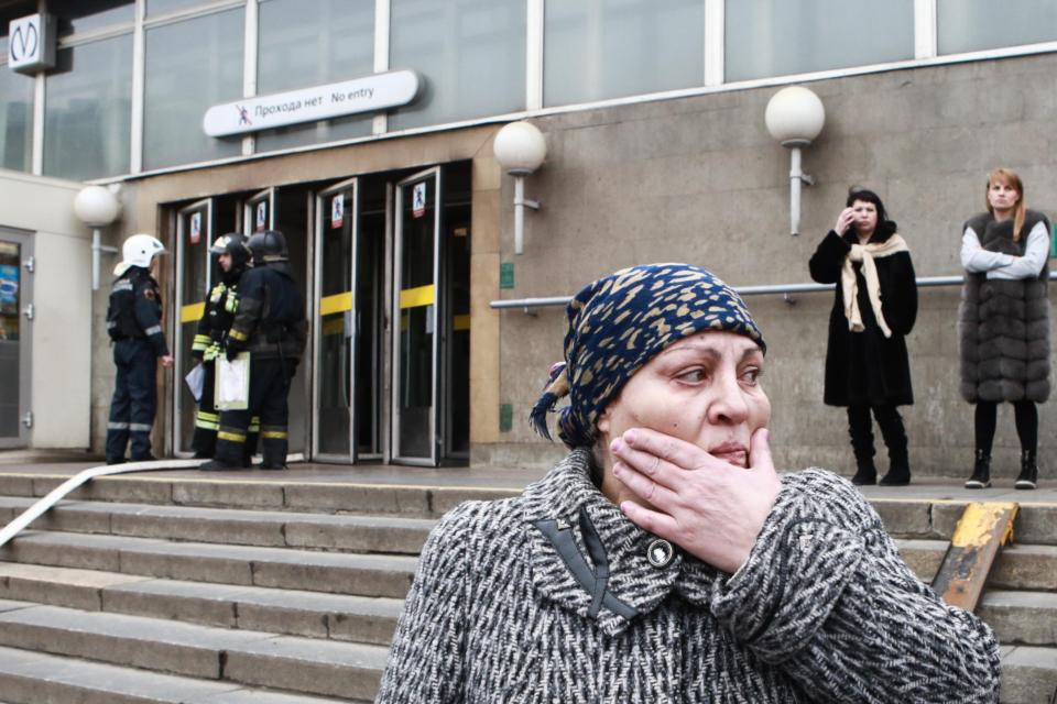  A shocked passenger at the entrance to Sennaya Ploshchad station of the St Petersburg metro in the aftermath of the explosion