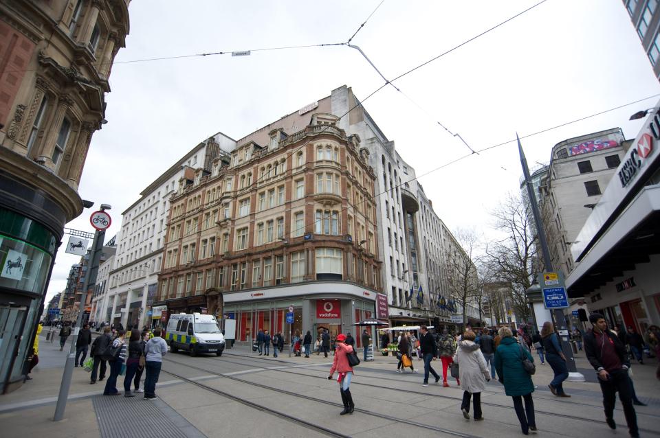 A view across the Metro Tram lines of Corporation Street showing the Britannia Hotel 