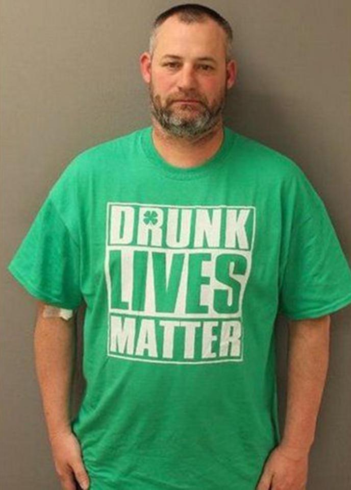  Elwood Gutshall III, 44, was wearing this ironic St Patrick's Day shirt when he was stopped - making for an interesting mugshot