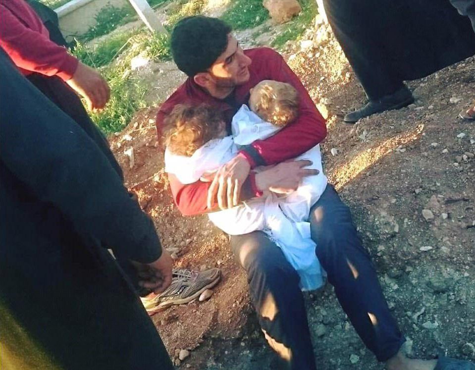  A devastated father has shared photos of him holding his deceased twins in his arms after they were killed in a suspected chemical gas attack in Syria