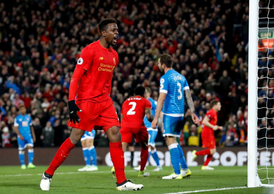  The Belgian striker Divock Origi celebrates his goal in front of the Kop end