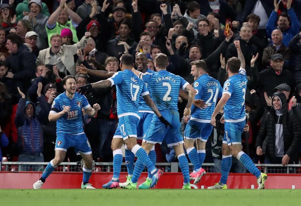  Bournemouth celebrate after snatching a point at Anfield