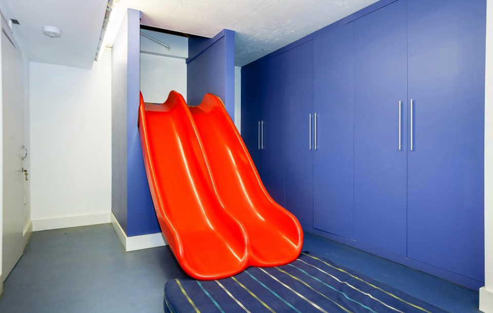  The two-person slide leads to cinema room with surround sound