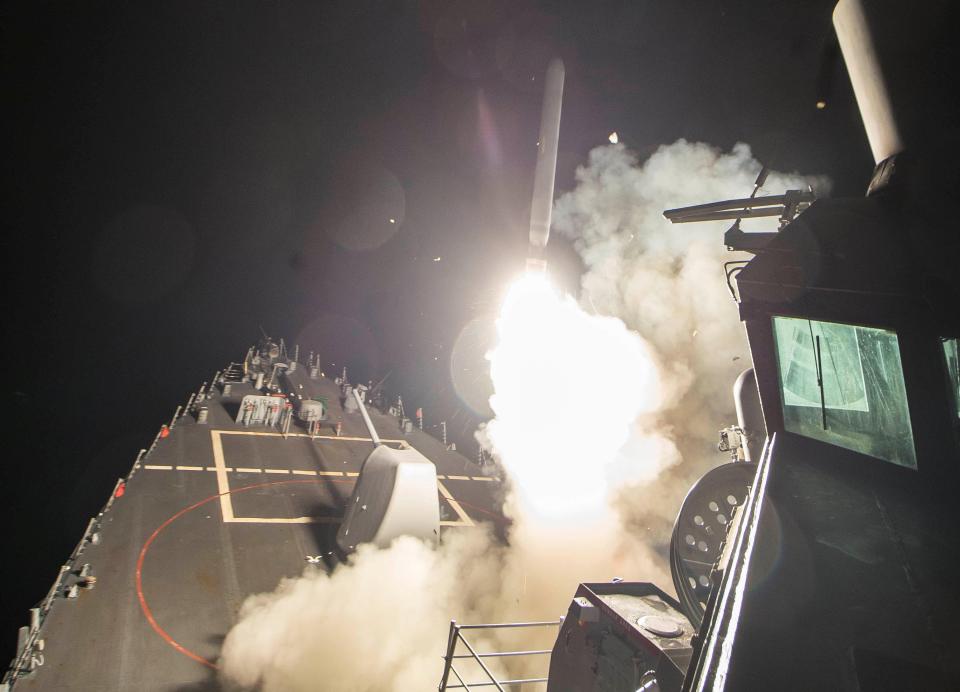  US Navy guided-missile destroyer USS Ross (DDG 71) fires a tomahawk land attack missile in Mediterranean Sea which US Defense Department said was a part of cruise missile strike against Syria on April 7