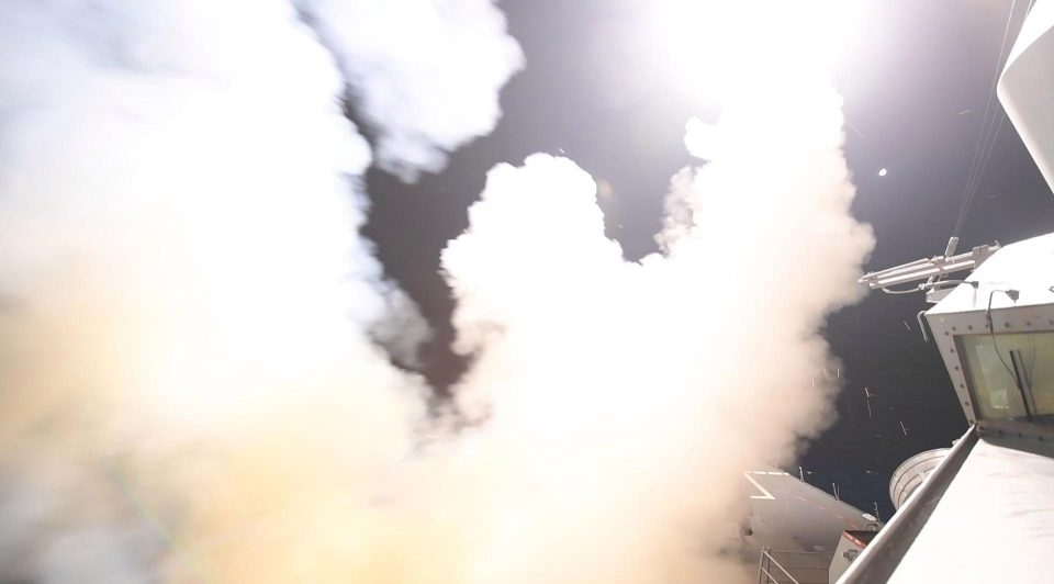  Smoke rises from the deck of the USS Porter as the United States blasted a Syrian air base