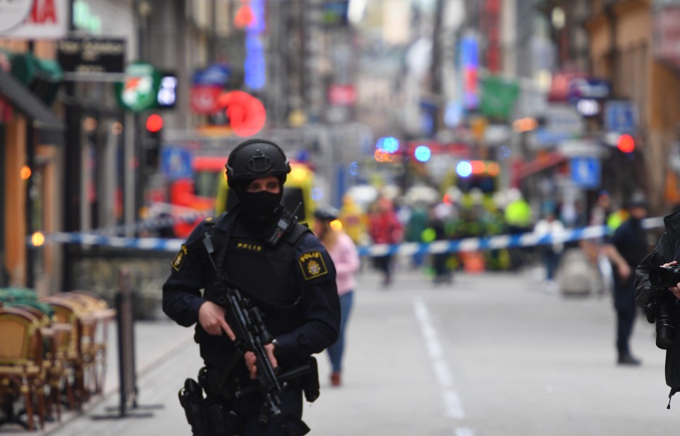 Armed police stand guard amid reports several suspects may be on the run