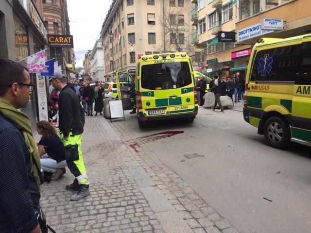 Pools of blood are visible on the streets in the shopping area