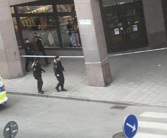 A man appears to be led away by police in a picture shared on Twitter, but cops denied making any arrests