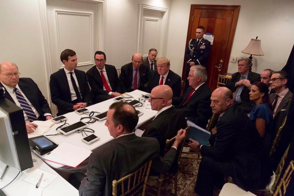  President Trump can be seen being briefed by video link at his Mar-a-Lago resort with his secretary of state Rex Tillerson on his left