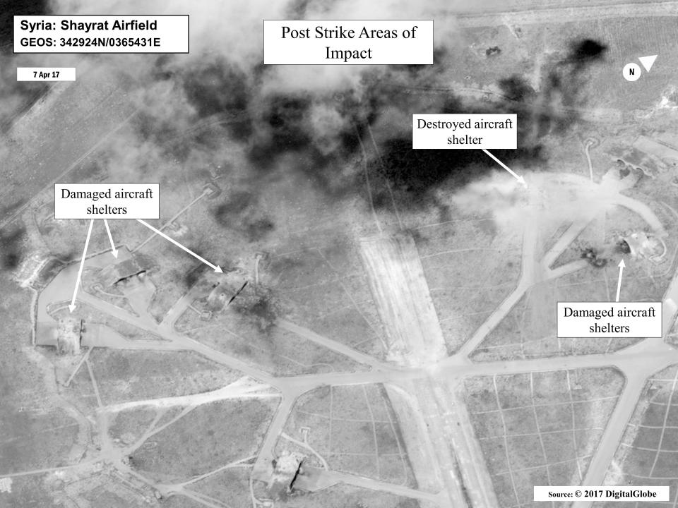  This satellite image shows damaged and destroyed aircraft shelters on the airbase near Homs in Syria