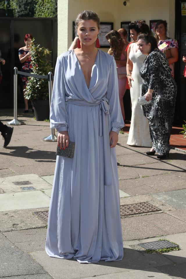  Chloe Lewis looked chic in a plunging pale blue silk gown