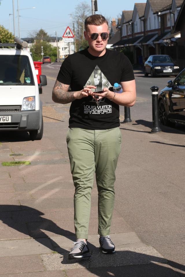  Tommy Mallett looked casual in green chinos and a black tshirt