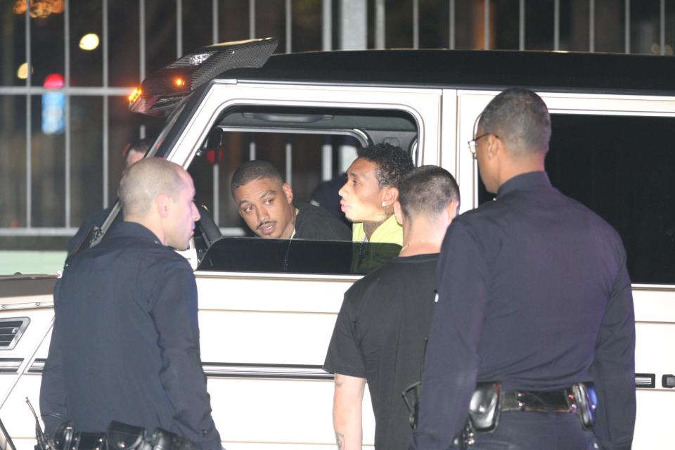  Tyga was pictured speaking to police officers