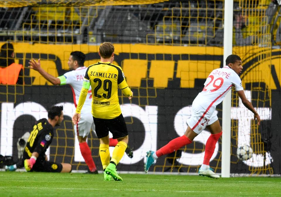  Kylian Mbappe reels away after opening the scoring in quarter-final first leg