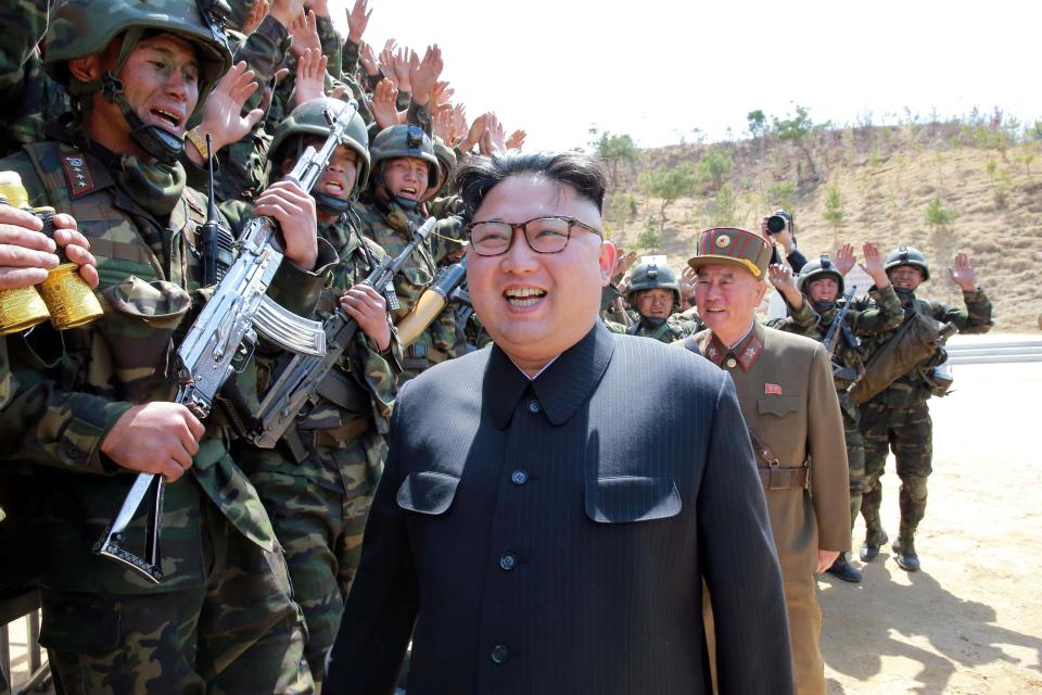  Kim Jong-un walks past a group of North Korean soldiers