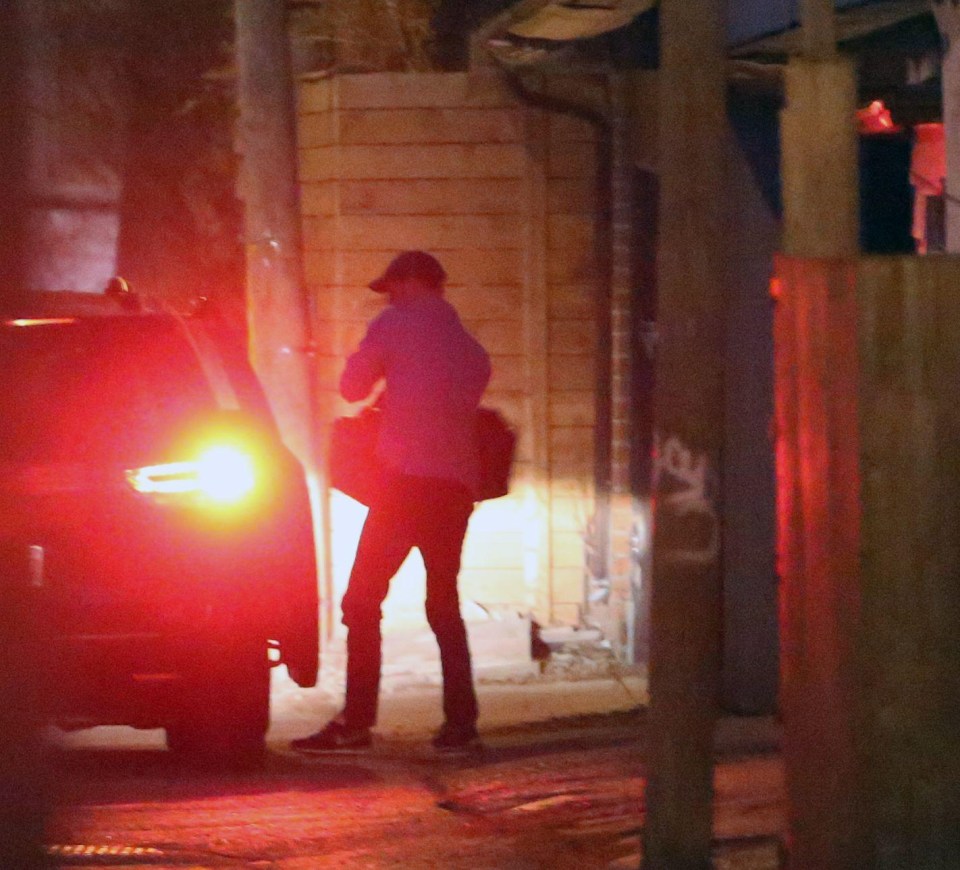 The prince was pictured carrying an overnight bag as he arrived under the cover of darkness