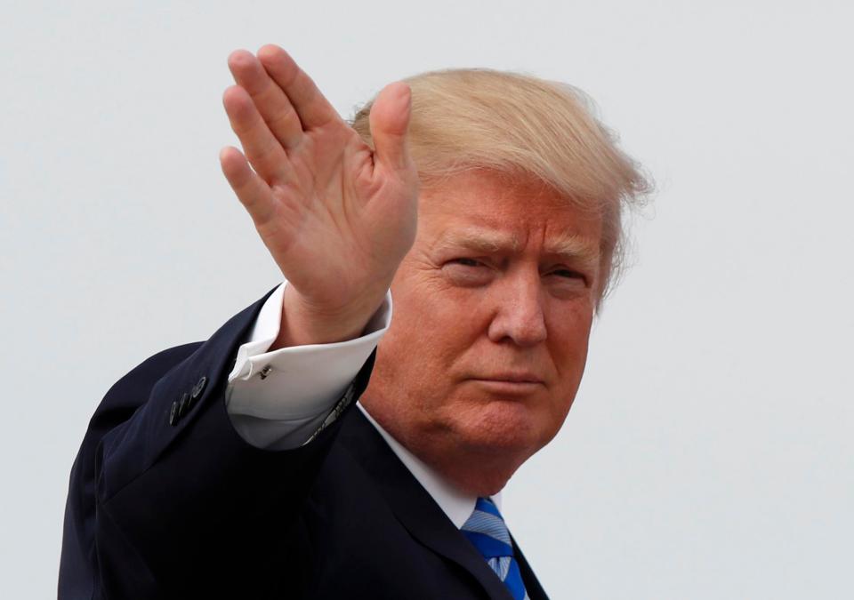  President Donald Trump waves as he boards Air Force One today before his departure from Andrews Air Force