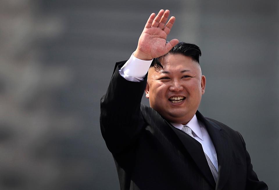  Dictator Kim watched on smiling as his military marched past